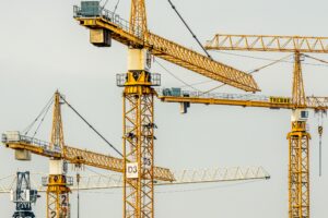 Construction noise from heavy machinery, like cranes, needs to be managed carefully.